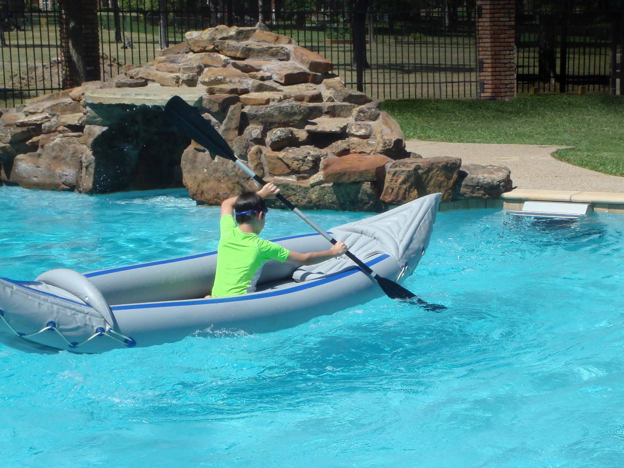a kayaker paddles in place with the Endless Pools Fastlane current