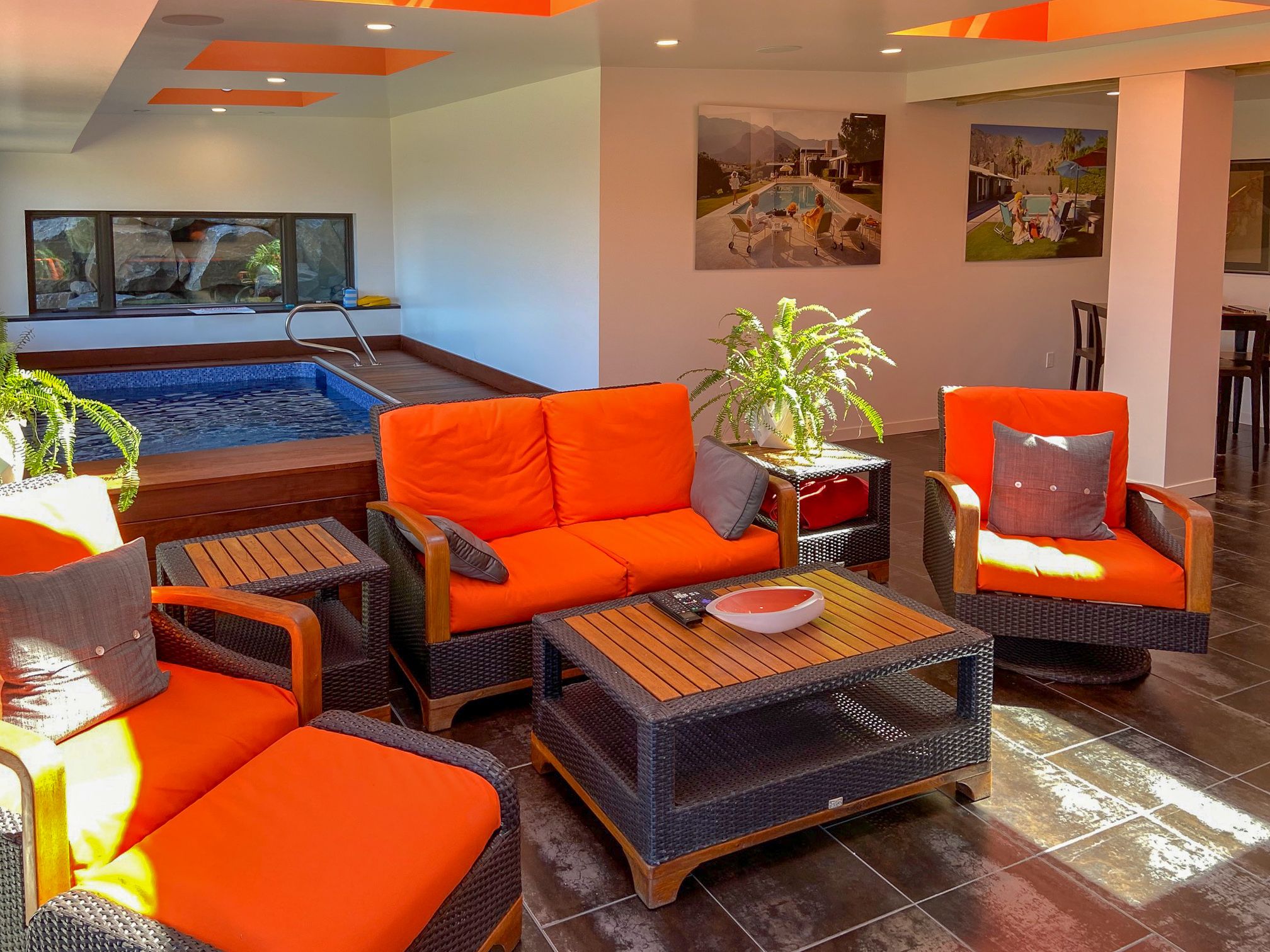 picture of a bright Endless Pools sunroom with splashes of orange