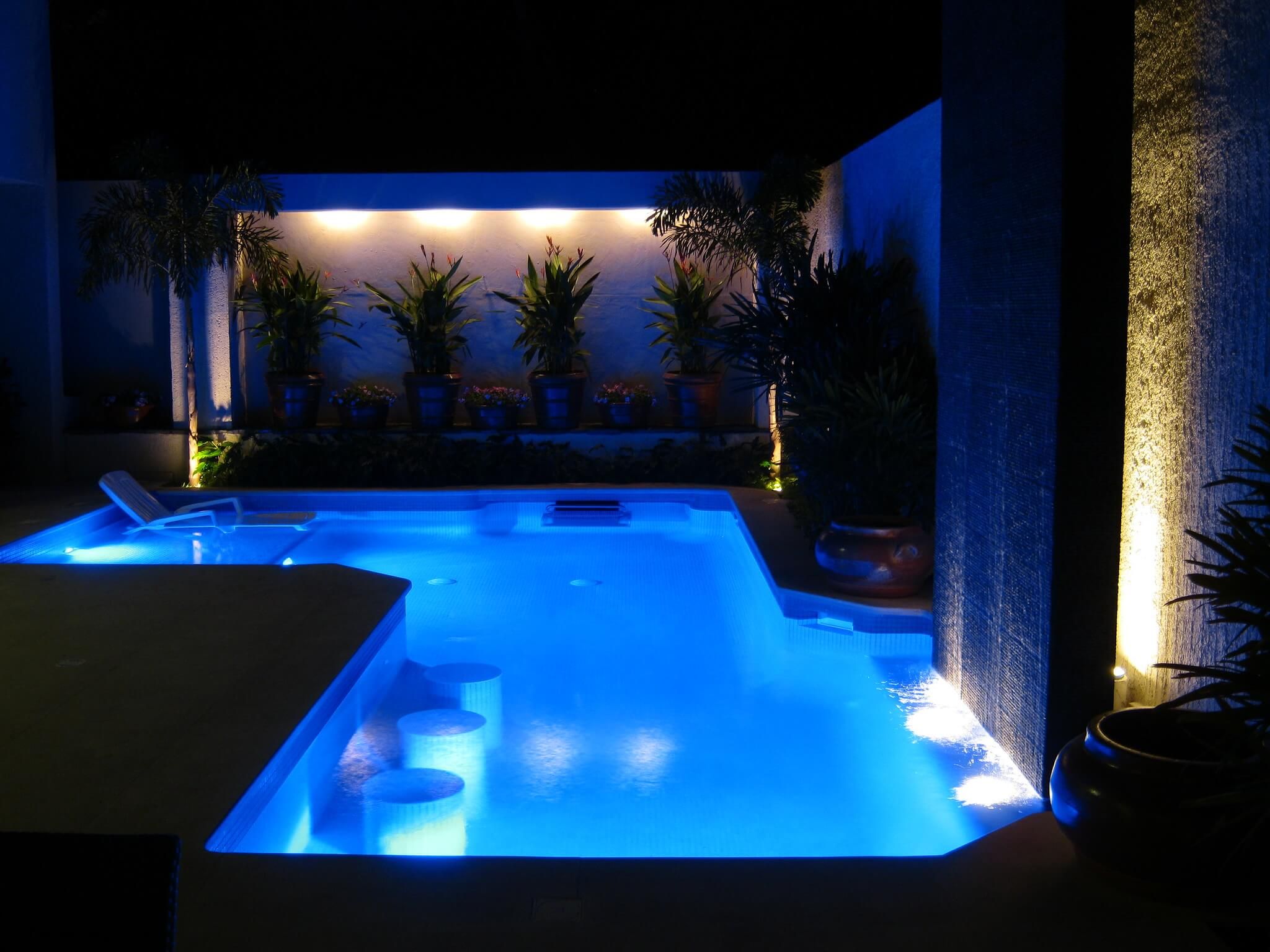picture of an Endless Pools Fastlane swim-current generator installed in a traditional in-ground pool
