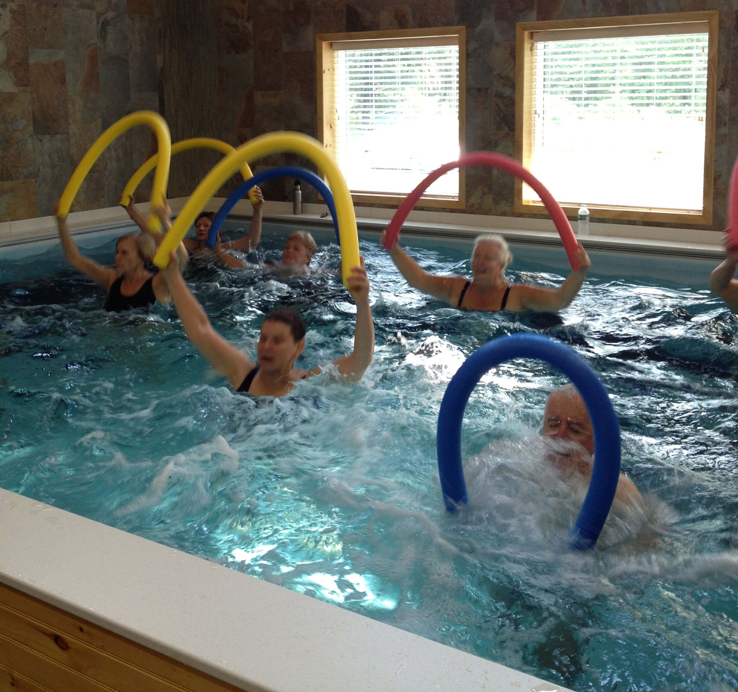 an aquatic aerobics class in the Endless Pool at Pike Physical Therapy
