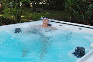 picture of Olympic swimmer Rowdy Gaines relaxing in an Endless Pools swim spa