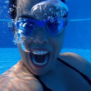 a swimmer underwater in a swimming pool