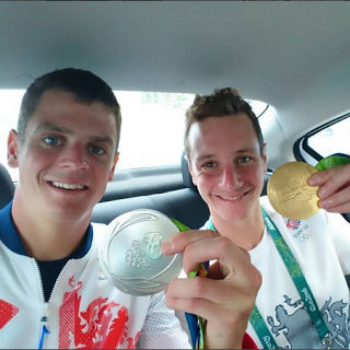 picture of Olympic triathletes Jonny and Alistair Brownlee with their Olympic medals 