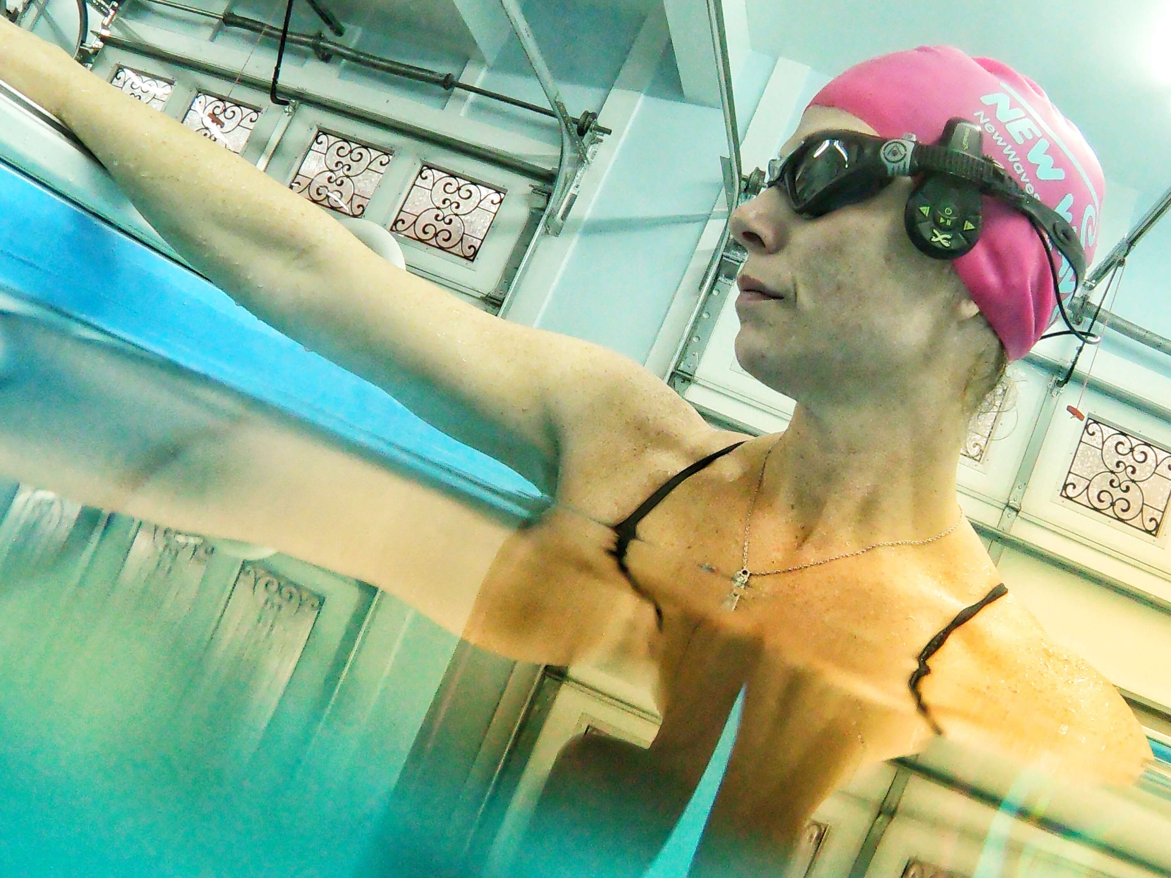 Picture of triathlete, coach & mom Melissa in the Endless Pools High Performance pool in her garage