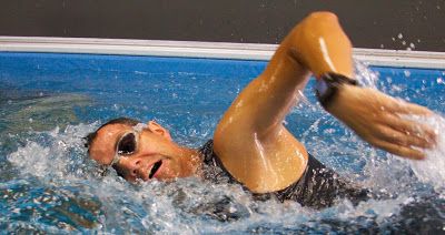 Chip Beard competes in the indoor triathlon in the Endless Pools swimming machine at GPP Endurance