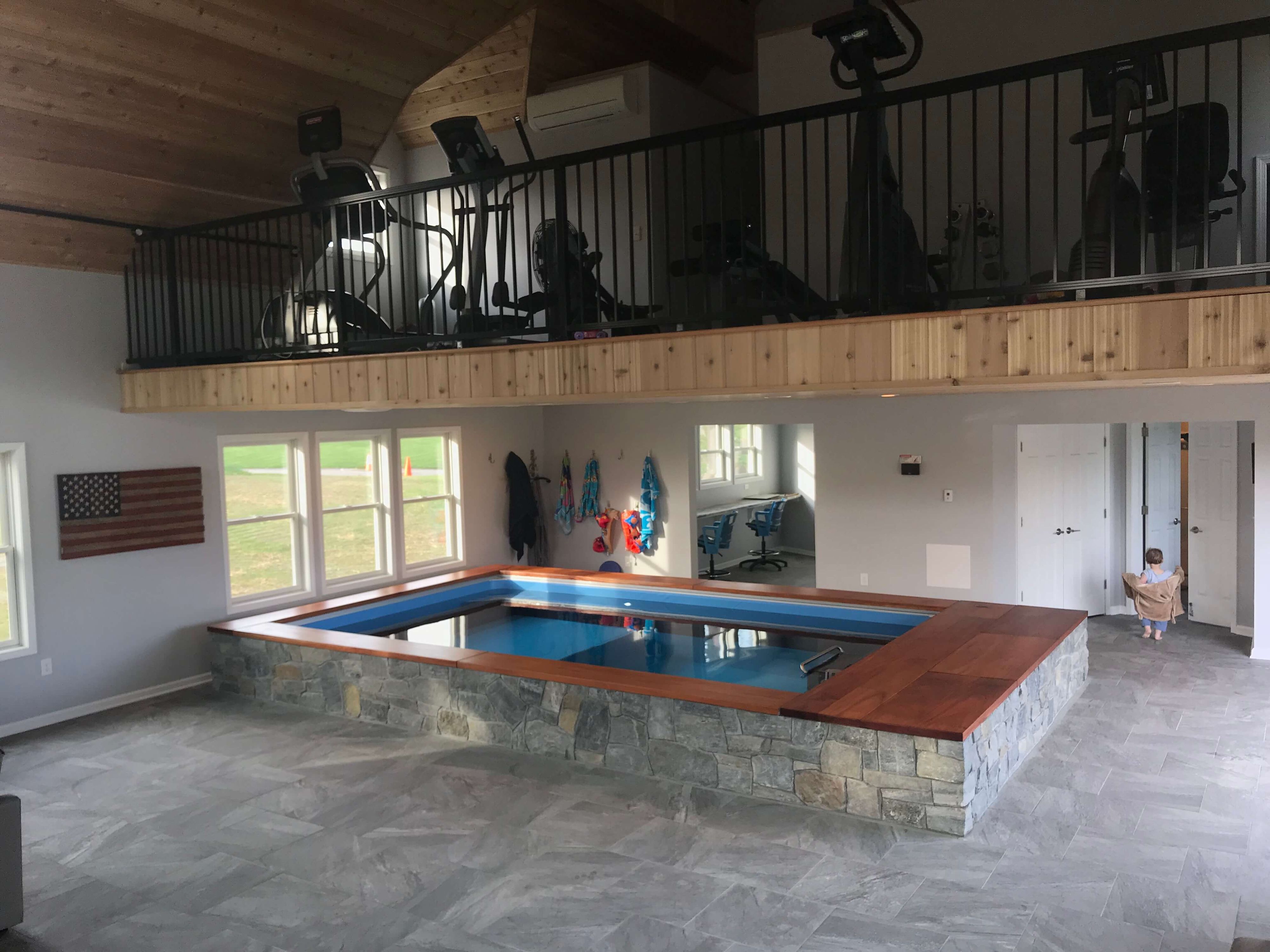 picture of a pain cave outside Pittsburgh with an Endless Pool and a mezzanine
