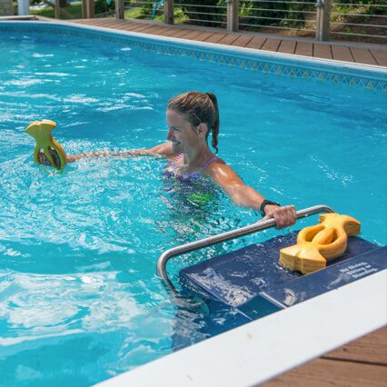 Woman doing aqua aerobics in a pool