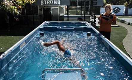 Picture of a swimmer in an outdoor swim spa