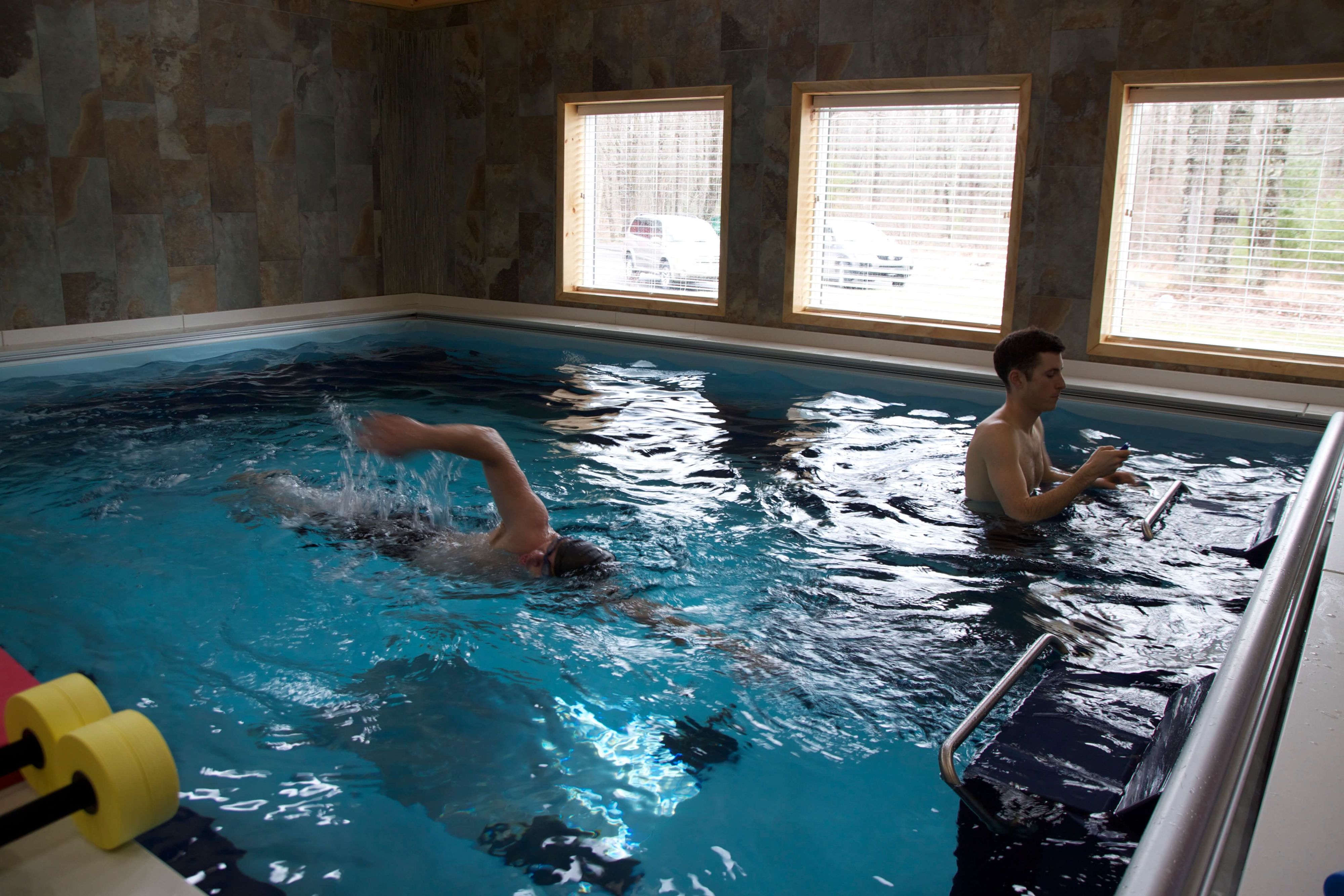 Two clients in the Dual Propulsion Endless Pool at Pike Physical Therapy