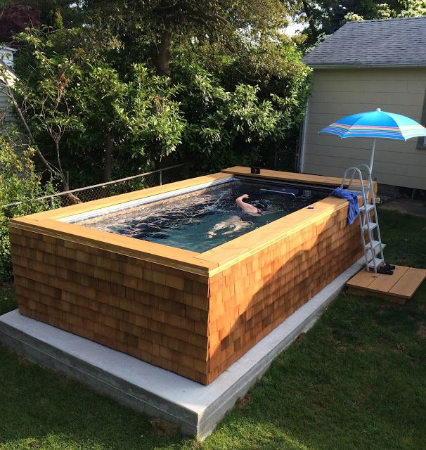 picture of an outdoor, cedar-skirted Endless Pools Original model