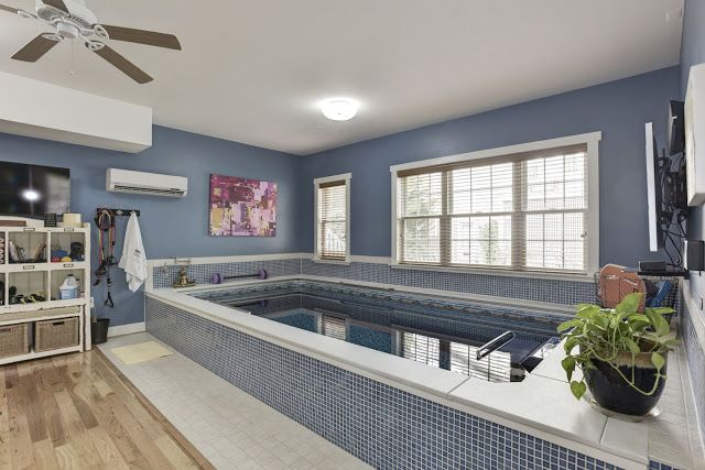 A partially in-ground Endless Pool in a converted garage