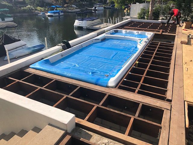 picture of the Endless Pools Fitness System E2000 swim spa during deck installation