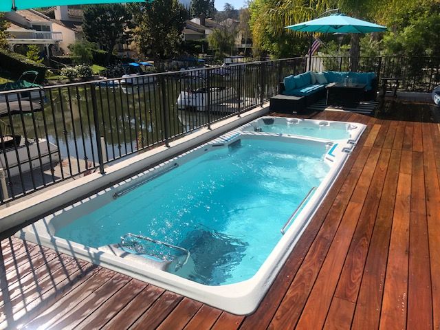 picture of the Endless Pools Fitness System E2000 swim spa in a ipa wood deck