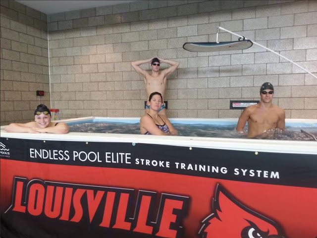 Kelsi Worrell and other Cardinal swimmers in the Elite Endless Pool at the University of Louisville