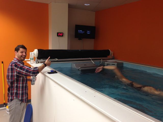 Coach Dominic Latella gives thumbs-up at the Endless Pool at his SwimBox studio
