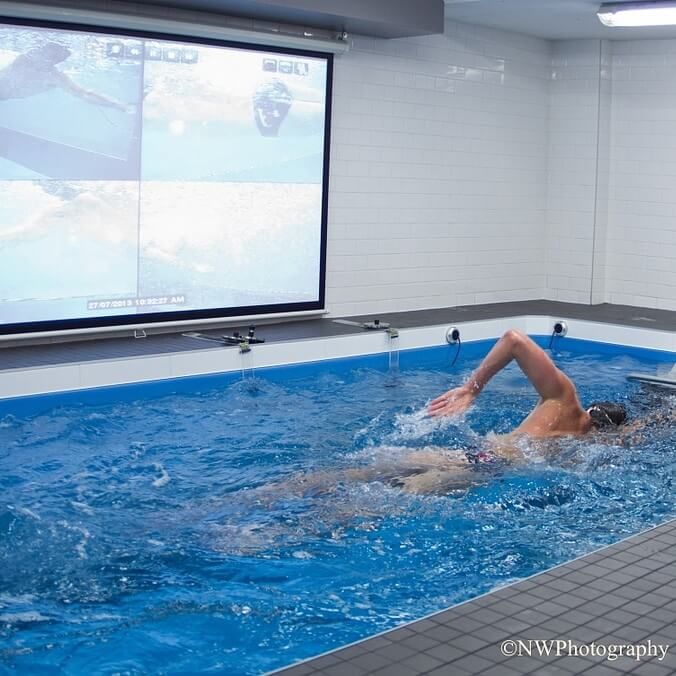 picture of a freestyle swimmer getting video analysis of his Endless Pools swim