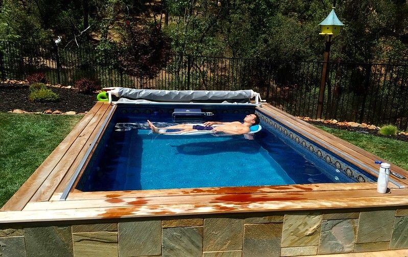 picture of a man relaxes in his Endless Pools&reg; Original model