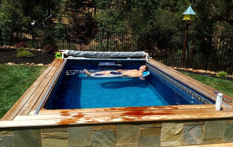 picture of a man floating carelessly in an Endless Pools Custom Series pool
