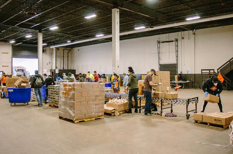 Philadbundance volunteers box food for families in need.