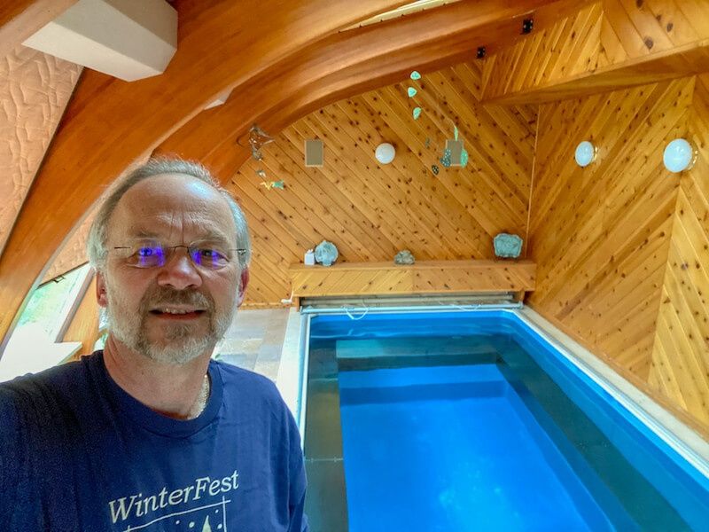 picture of Jim with his Endless Pools Original model installed indoors in his Iowa home