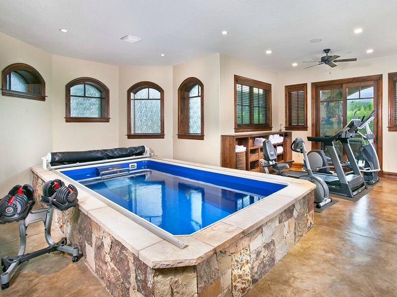 picture of triathlete's home gym with Endless Pools swimming pool