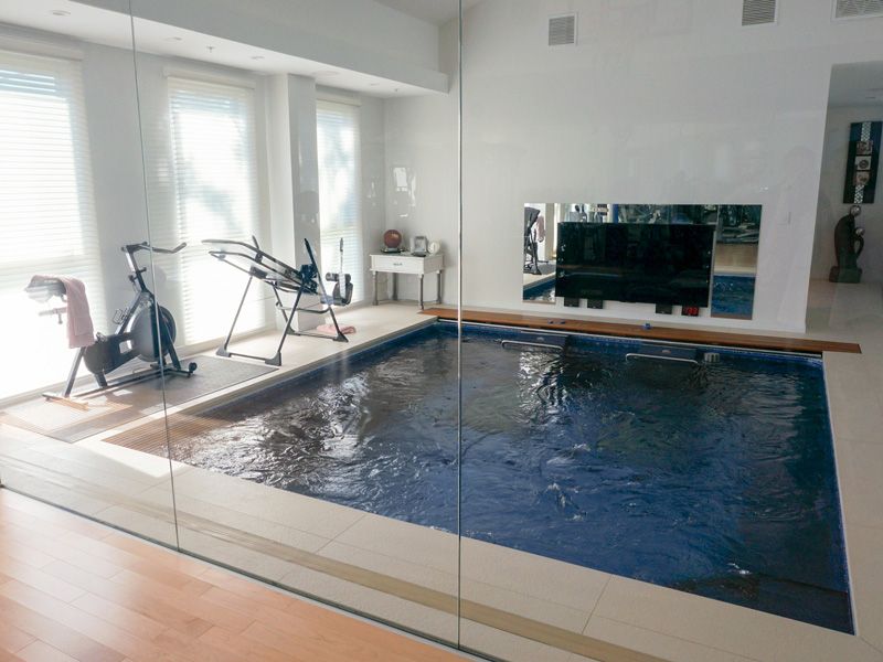 picture of Endless Pools Dual Propulsion pool in an indoor home gym