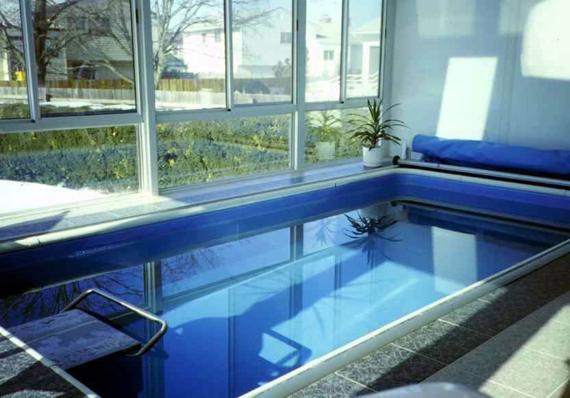 the Endless Pools swimming machine in Cara Lyn Overton's sunroom
