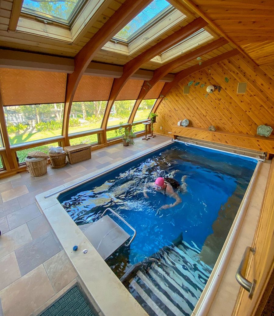picture of swimmer in the indoor Endless Pools Original sunroom pool