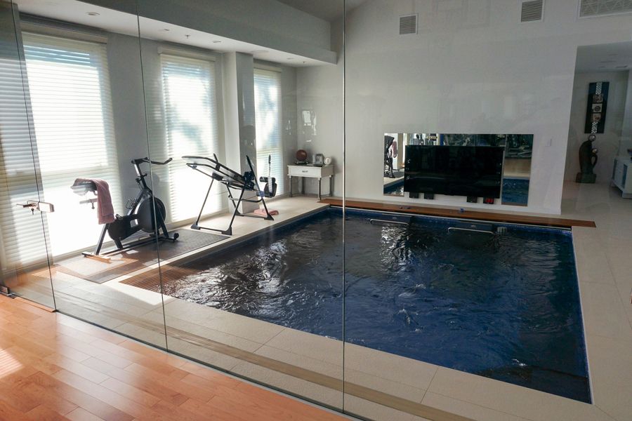 picture of home gym with an Endless Pools inground pool