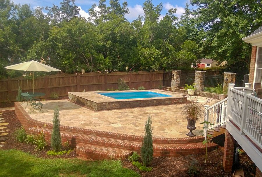picture of partially in-ground Endless Pools Original model patio pool