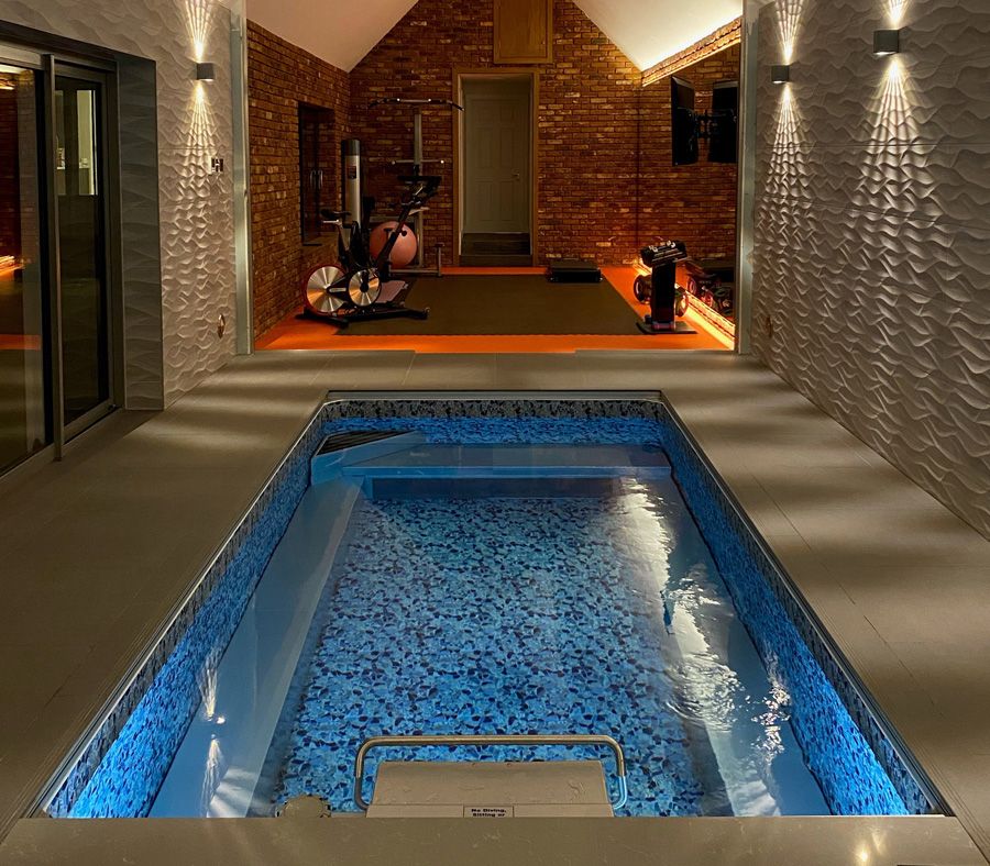 picture of indoor Endless Pools Original Series pool in a renovated garage home gym