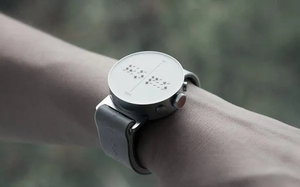 A dotted watch on a person's wrist