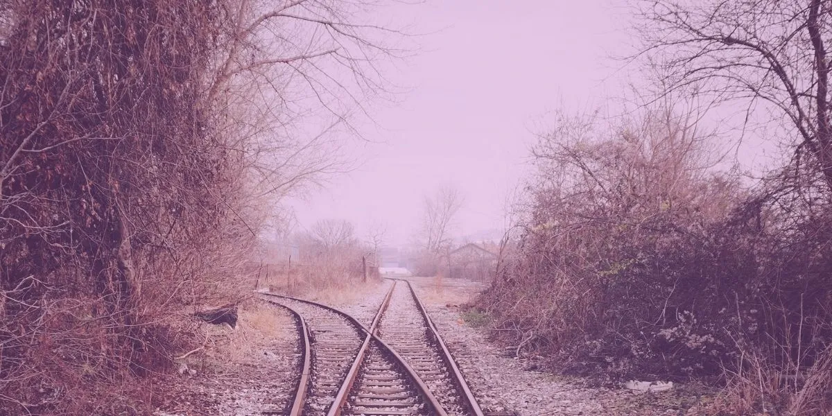Railroad tracks splitting off, represents how content marketers have to make a decision about what content to produce
