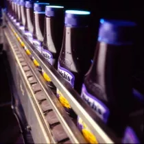 Conveyor belt loaded with Welch's jellies squeezable containers