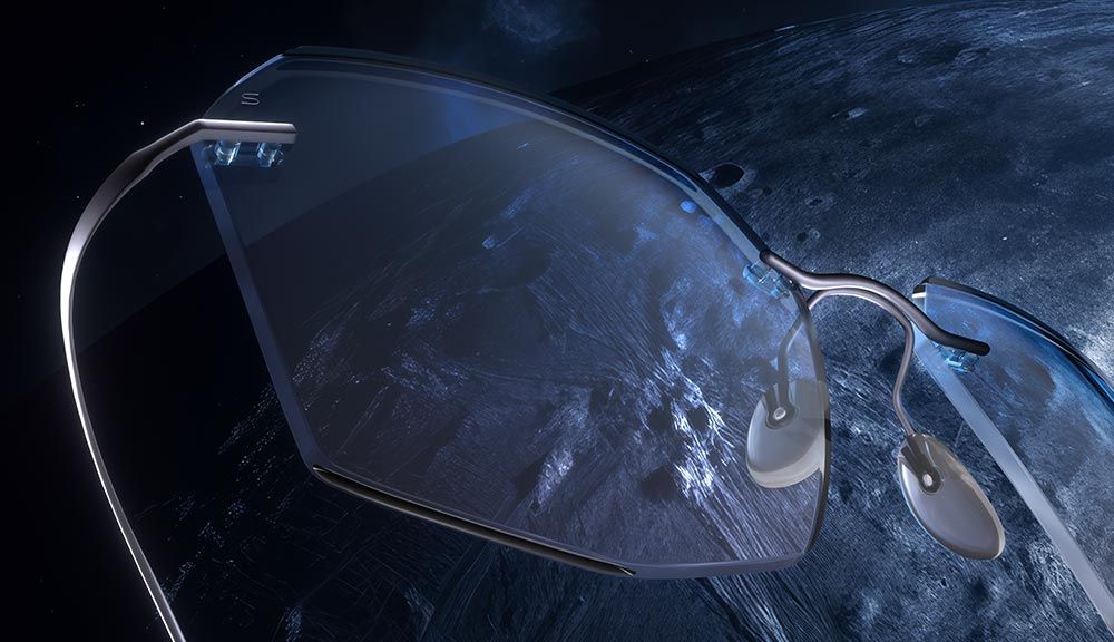 Une paire de lunettes Titan Minimal Art Highlight flotte dans l'espace