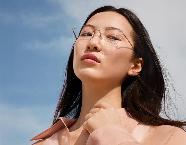 Woman wearing glasses with lenses, tinted in two colors