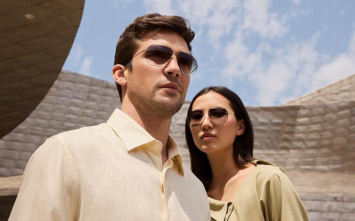 Two people wearing Titan Minimal Art sunglasses