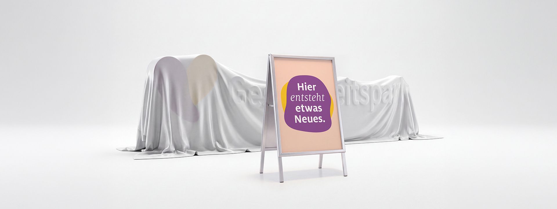 Grafische Darstellung eines Aufstellers mit der Aufschrift "Hier entsteht etwas Neues" 