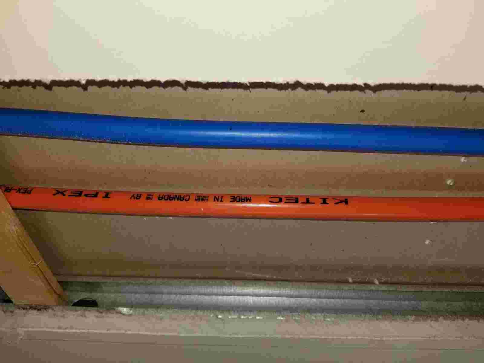 Red and Blue KITEC pipes inside drywall