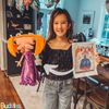 girl drawing into custom toy