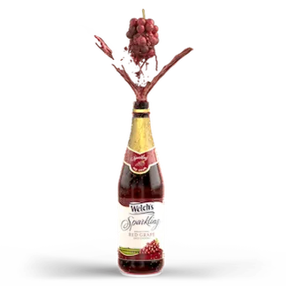 Bunch of red grapes swirling and splashing into a bottle of Welch's Sparkling Red Grape Juice