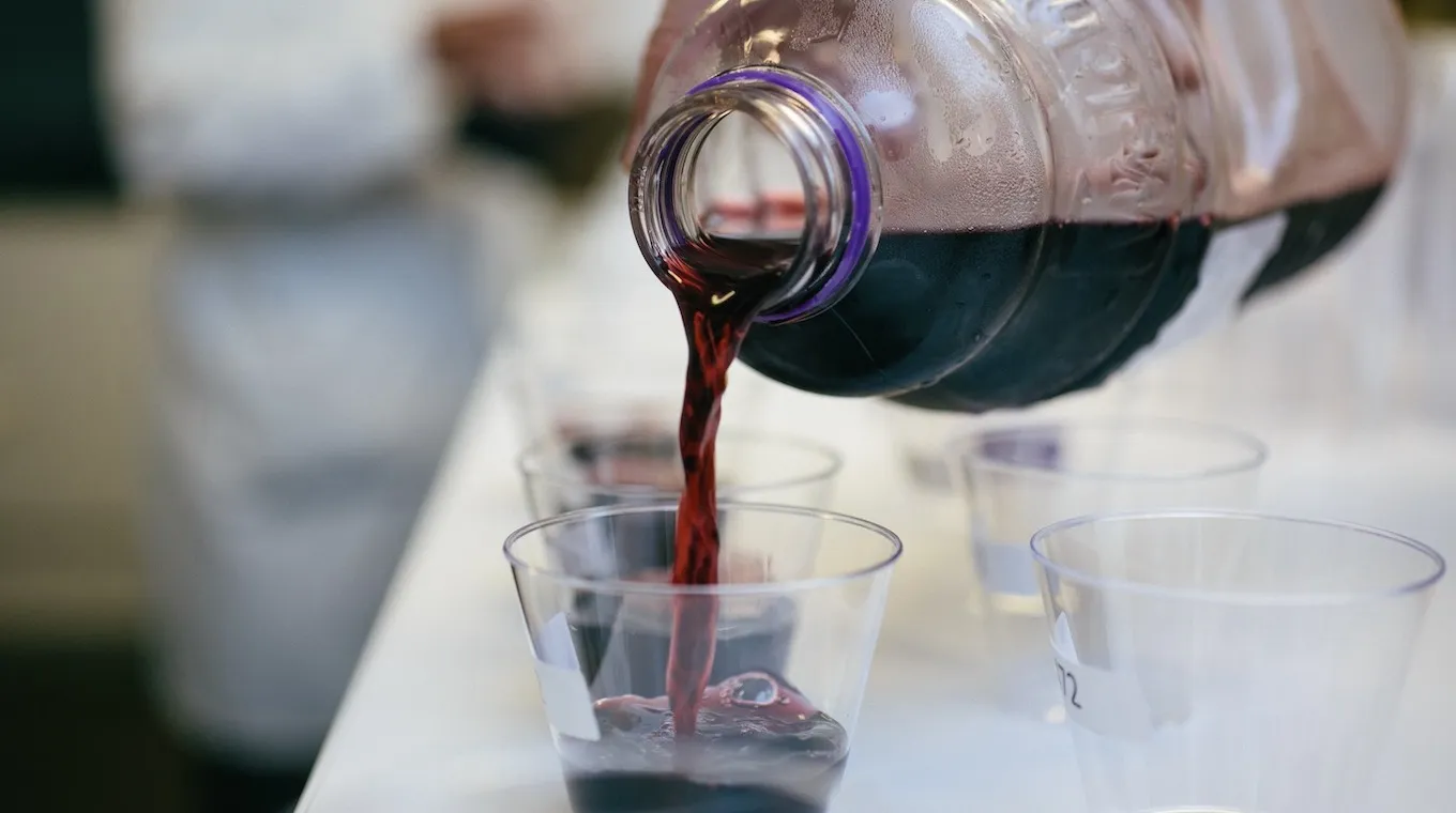 Pouring Welch's Concord Grape Juice into cups